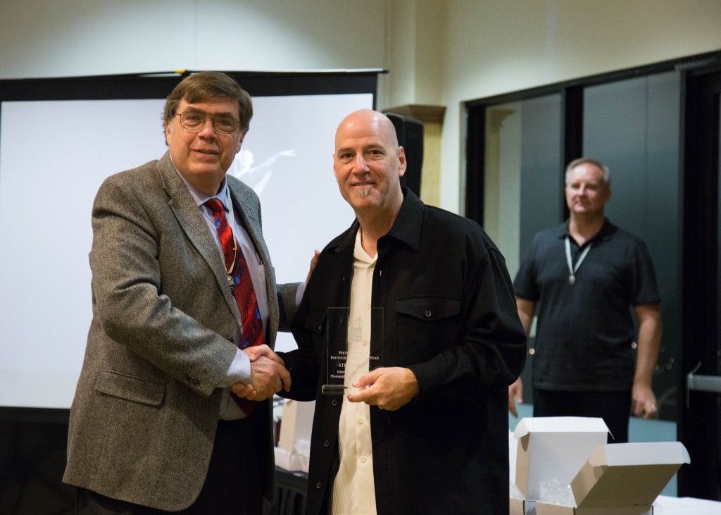 Steve Brazil receives his award for Photojournalist of the Year