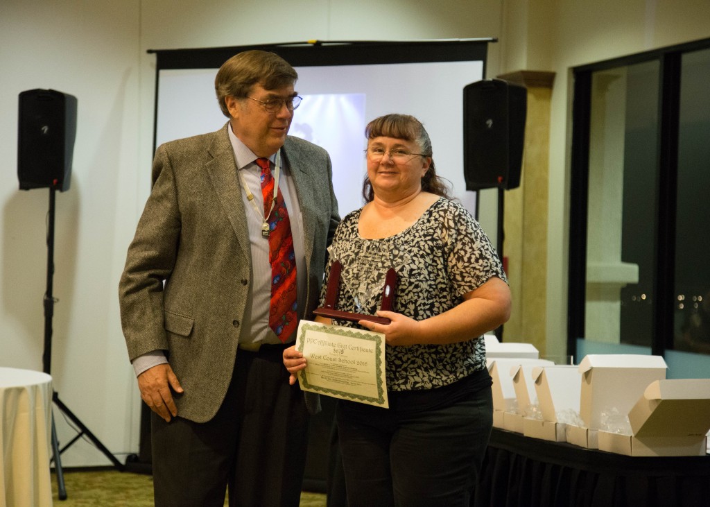 Kim receives her EPPV Service Award Medallion